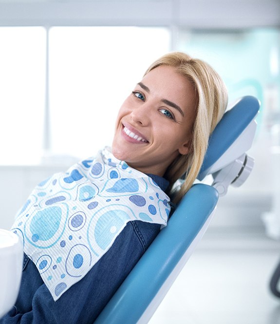 Woman smiling in dentist's treatment chair