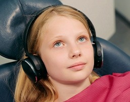 A girl relaxing in a dental chair