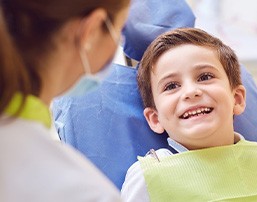 A little boy smiling at the dentist