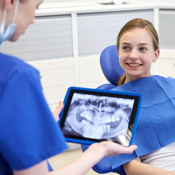 Smiling young girl during dental checkup