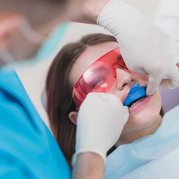 Young girl receiving fluoride treatment