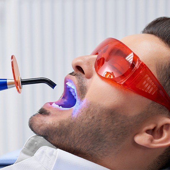 Older man receiving dental bonding treatment