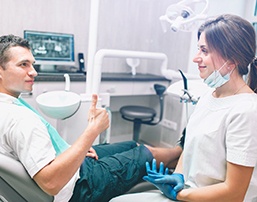 Cosmetic dentist in Grand Prairie smiling at her patient