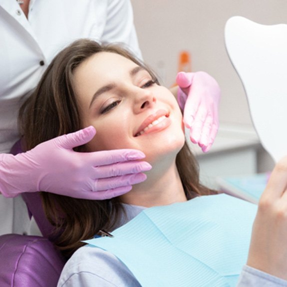 A woman receiving treatment from a cosmetic dentist in Grand Prairie