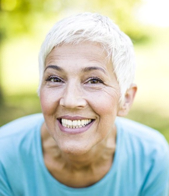 senior woman with dentures in Grand Prairie showing off her smile