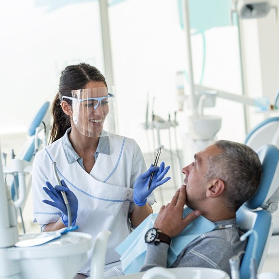 Dentist talking to patient about tooth extractions