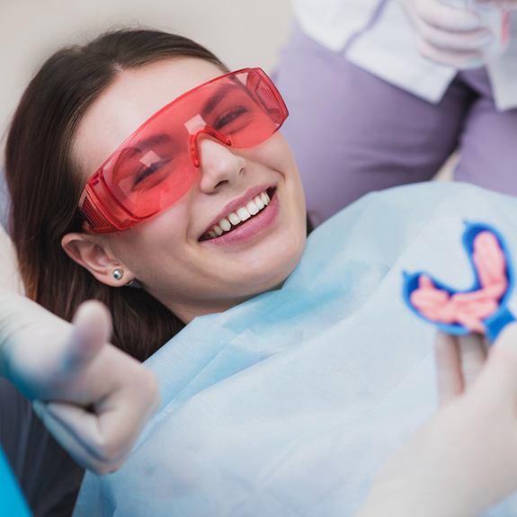 Teen smiling before fluoride treatment