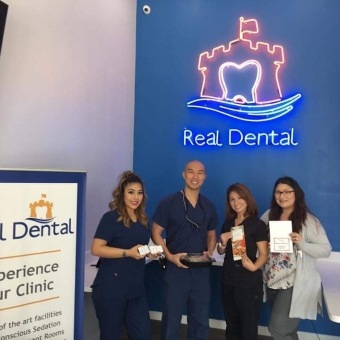 Four dental team members at community event