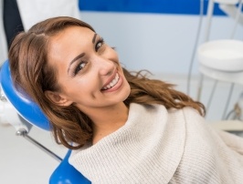 Smiling woman in dental chair during dental checkup