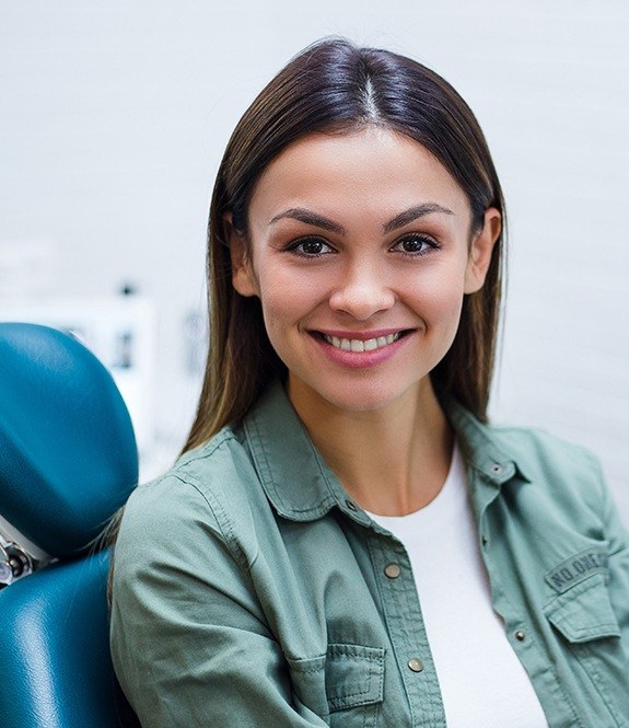Woman smiling in the dental office for preventive dentistry