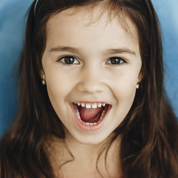 Happy child at dental office after oral conscious sedation for children