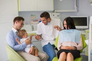 couple and their young son visiting a family dentist 