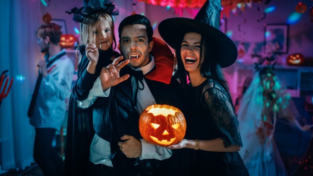 family dressed in Halloween costumes